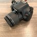 Canon EOS Rebel T100 DSLR Camera with EF-S 18-55mm Lens and Charger 